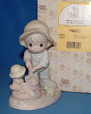 Precious Moments: 603864 Nothing Can Dampen the Spirit of Caring