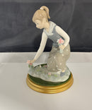 Lladro Girl Gathering Flowers