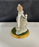 Lladro Girl Gathering Flowers