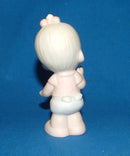 Precious Moments: E-2852B Baby Girl Standing with Bow